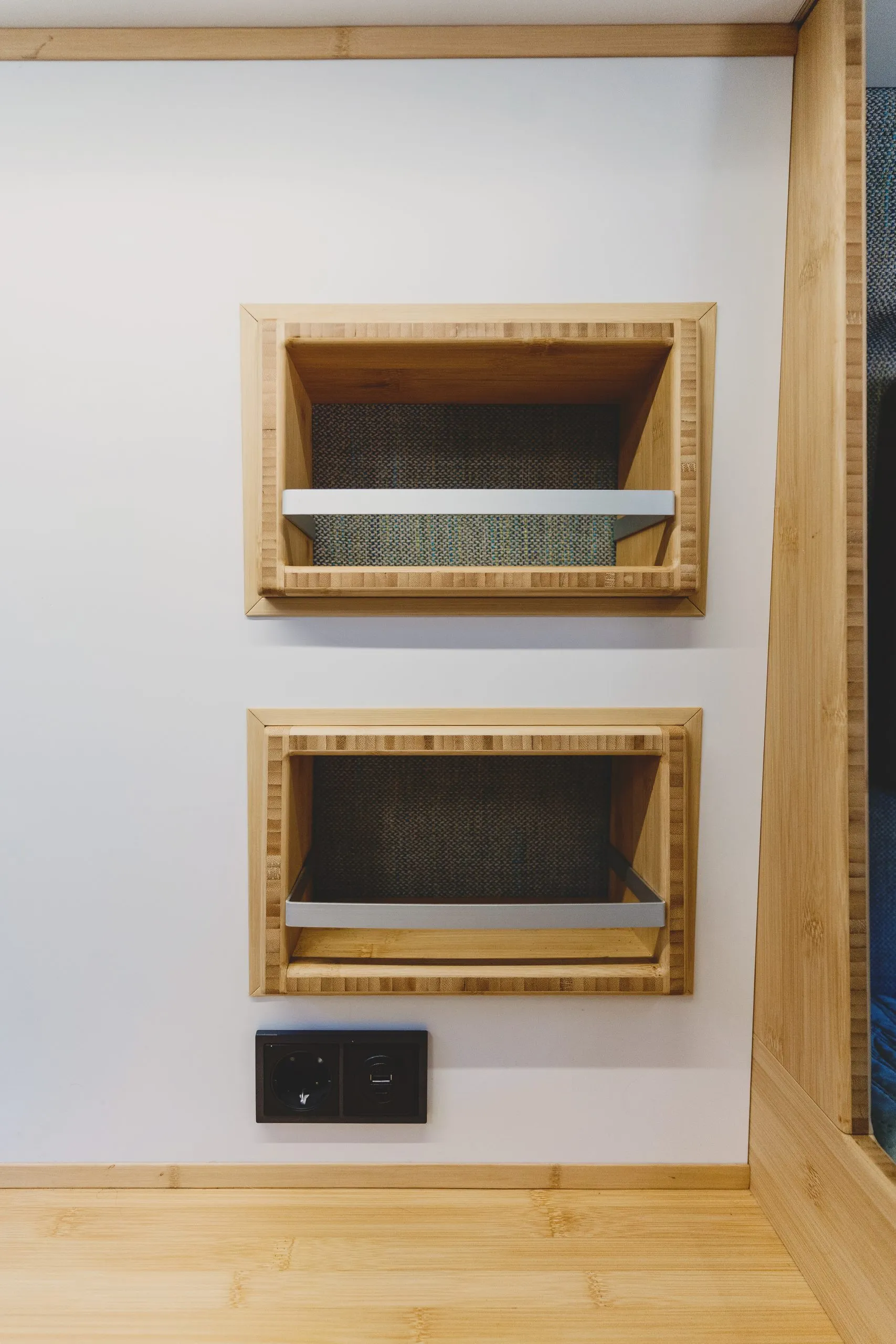 Bamboo shelves built into the van wall